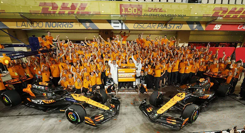 The McLaren team celebrate securing the Constructors Championship title