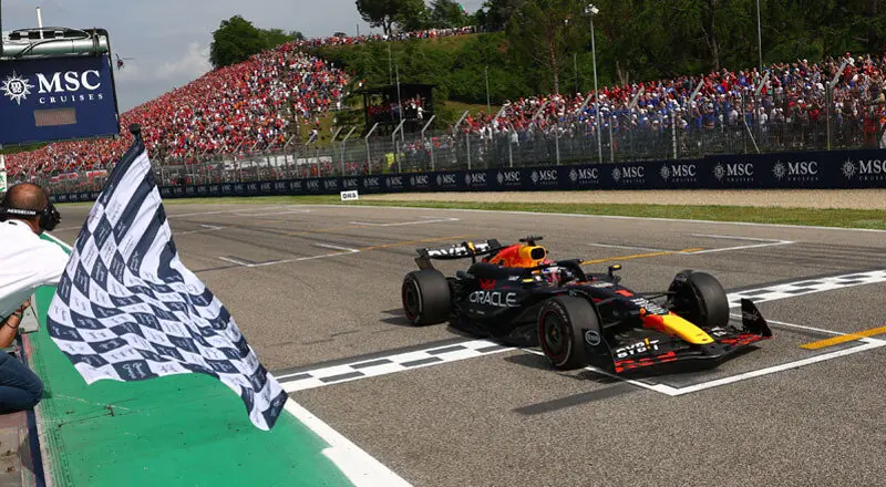 IMOLA, ITALY - MAY 19: Race winner Max Verstappen of the Netherlands driving the (1) Oracle Red Bull Racing RB20 takes the chequered flag during the F1 Grand Prix of Emilia-Romagna at Autodromo Enzo e Dino Ferrari Circuit on May 19, 2024 in Imola, Italy. (Photo by Clive Rose/Getty Images) // Getty Images / Red Bull Content Pool // SI202405190537 // Usage for editorial use only //