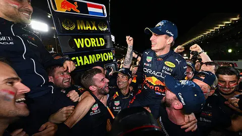 SUZUKA, JAPAN - OCTOBER 09: Race winner and 2022 F1 World Drivers Champion Max Verstappen of Netherlands and Oracle Red Bull Racing celebrates with his team after the F1 Grand Prix of Japan at Suzuka International Racing Course on October 09, 2022 in Suzuka, Japan. (Photo by Clive Mason/Getty Images)