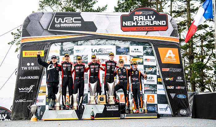 Kalle Rovanpera (FIN) Jonne Halttunen (FIN) of team Toyota Gazoo Racing   celebrate on the podium in first place after winning the World Rally Championship in Auckland, New-Zealand on 2.10.2022 with Sebastien Ogier (FRA) Julien Ingrassia (FRA) of team Toyota Gazoo Racing second place and Ott Tanak (EST) Martin Jarveoja (EST) of team Hyundai Shell Mobis third place // Jaanus Ree / Red Bull Content Pool // SI202210020141 // Usage for editorial use only // 