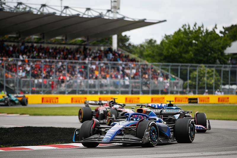 CIRCUIT GILLES-VILLENEUVE, CANADA - JUNE 18: Alex Albon, Williams FW45, leads Esteban Ocon, Alpine A523 during the Canadian GP at Circuit Gilles-Villeneuve on Sunday June 18, 2023 in Montreal, Canada. (Photo by Jake Grant / LAT Images)
