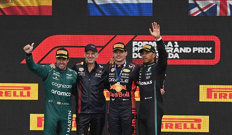 CIRCUIT GILLES-VILLENEUVE, CANADA - JUNE 18: Fernando Alonso, Aston Martin F1 Team, 2nd position, Adrian Newey, Chief Technology Officer, Red Bull Racing, Max Verstappen, Red Bull Racing, 1st position, and Sir Lewis Hamilton, Mercedes-AMG, 3rd position, on the podium during the Canadian GP at Circuit Gilles-Villeneuve on Sunday June 18, 2023 in Montreal, Canada. (Photo by Mark Sutton / LAT Images)