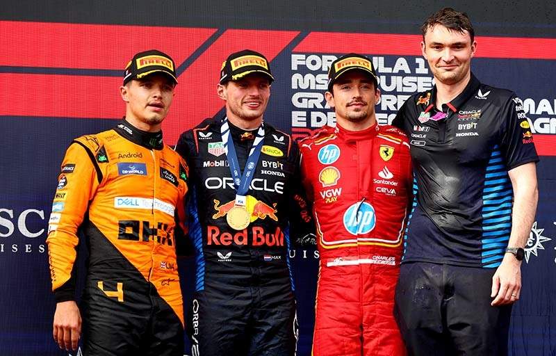 IMOLA, ITALY - MAY 19: Race winner Max Verstappen of the Netherlands and Oracle Red Bull Racing, Second placed Lando Norris of Great Britain and McLaren, Third placed Charles Leclerc of Monaco and Ferrari and David Morgan, Aero Trackside Performance Team Leader at Oracle Red Bull Racing celebrate on the podium during the F1 Grand Prix of Emilia-Romagna at Autodromo Enzo e Dino Ferrari Circuit on May 19, 2024 in Imola, Italy. (Photo by Clive Rose/Getty Images) // Getty Images / Red Bull Content Pool // SI202405190473 // Usage for editorial use only //