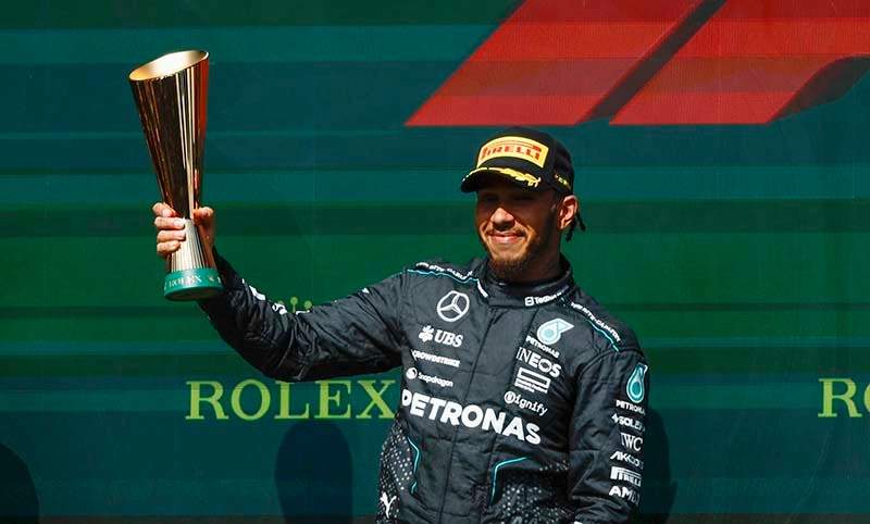 CIRCUIT DE SPA FRANCORCHAMPS, BELGIUM - JULY 28: Sir Lewis Hamilton, Mercedes-AMG F1 Team, 2nd position, holds the trophy aloft during the Belgian GP at Circuit de Spa Francorchamps on Sunday July 28, 2024 in Spa, Belgium. (Photo by Zak Mauger / LAT Images)