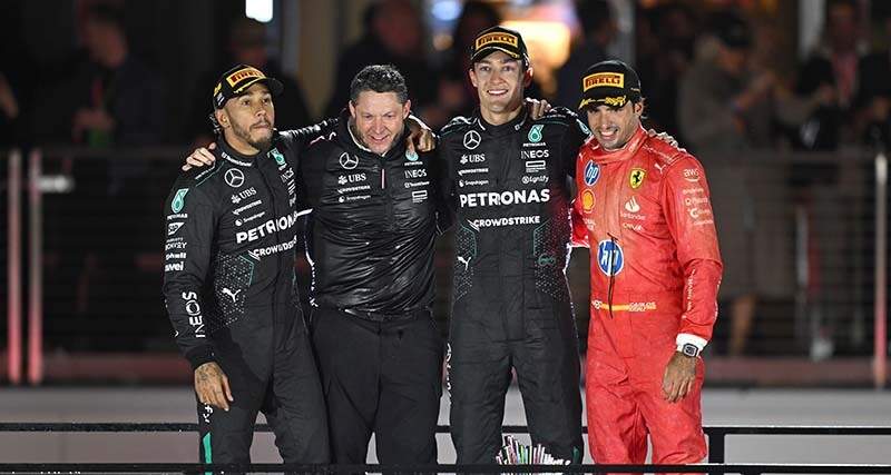 STREETS OF LAS VEGAS, UNITED STATES OF AMERICA - NOVEMBER 23: Sir Lewis Hamilton, Mercedes-AMG F1 Team, 2nd position, the Mercedes trophy delegate, George Russell, Mercedes-AMG F1 Team, 1st position, and Carlos Sainz, Scuderia Ferrari, 3rd position, on the podium during the Las Vegas GP at Streets of Las Vegas on Saturday November 23, 2024, United States of America. (Photo by Sam Bagnall / LAT Images)