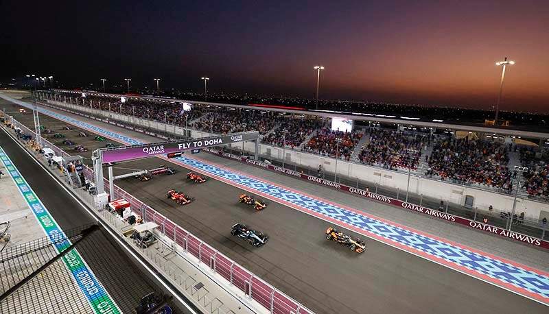 LOSAIL INTERNATIONAL CIRCUIT, QATAR - NOVEMBER 30: Lando Norris, McLaren MCL38, leads George Russell, Mercedes F1 W15, Oscar Piastri, McLaren MCL38 during the Qatar GP at Losail International Circuit on Saturday November 30, 2024 in Losail, Qatar. (Photo by Steven Tee / LAT Images)