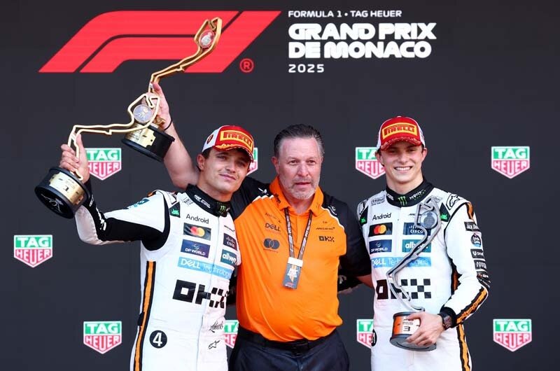MONTE-CARLO, MONACO - MAY 25: Race winner Lando Norris of Great Britain and McLaren, Third placed Oscar Piastri of Australia and McLaren and Zak Brown, Chief Executive Officer of McLaren celebrate on the podium during the F1 Grand Prix of Monaco at Circuit de Monaco on May 25, 2025 in Monte-Carlo, Monaco. (Photo by Clive Rose/Getty Images)