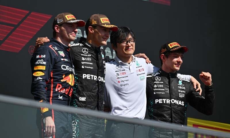 MONTREAL, QUEBEC - JUNE 15: Race winner George Russell of Great Britain and Mercedes AMG Petronas F1 Team Second placed Max Verstappen of the Netherlands and Oracle Red Bull Racing Third placed Andrea Kimi Antonelli of Italy and Mercedes AMG Petronas F1 Team and Katsu Kuwahara, Performance Engineer, Mercedes AMG Petronas F1 Team on the podium during the F1 Grand Prix of Canada at Circuit Gilles-Villeneuve on June 15, 2025 in Montreal, Quebec. (Photo by Minas Panagiotakis/Getty Images)