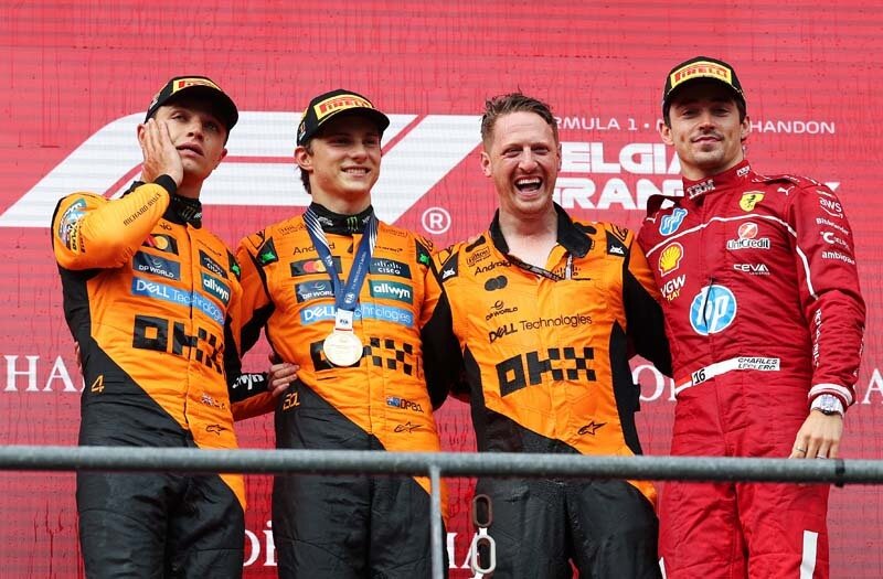 SPA, BELGIUM - JULY 27: Race winner Oscar Piastri of Australia and McLaren, Second placed Lando Norris of Great Britain and McLaren, Third placed Charles Leclerc of Monaco and Scuderia Ferrari and the McLaren Trophy Delegate celebrate on the podium during the F1 Grand Prix of Belgium at Circuit de Spa-Francorchamps on July 27, 2025 in Spa, Belgium. (Photo by Ryan Pierse/Getty Images)