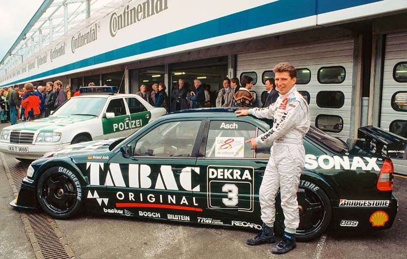 Roland Asch, ehemaliger Mercedes-Benz Rennfahrer und Markenbotschafter von Mercedes-Benz Classic. Foto am AMG-Mercedes C-Klasse Rennsport-Tourenwagen während des Rennsport-Festivals auf dem Hockenheimring am 24. April 1994. (Fotosignatur der Archive von Mercedes-Benz Classic: A94F460) 

Roland Asch, former Mercedes-Benz racing driver and Brand Ambassador for Mercedes-Benz Classic. Photo of the AMG-Mercedes C-Class racing touring car during the racing festival at the Hockenheimring on 24 April 1994. (Photo index number in the Mercedes-Benz Classic Archive: A94F460)