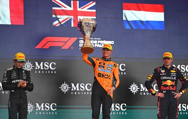 SAO PAULO, BRAZIL - NOVEMBER 09: Race winner Lando Norris of Great Britain and McLaren lifts the trophy in celebration during the F1 Grand Prix of Brazil at Autodromo Jose Carlos Pace on November 09, 2025 in Sao Paulo, Brazil. (Photo by Rudy Carezzevoli/Getty Images)