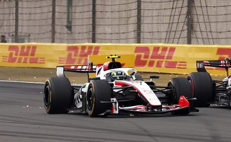 SHANGHAI, CHINA - MARCH 15: Oliver Bearman of Great Britain driving the (87) Haas F1 VF-26 Ferrari and Max Verstappen of the Netherlands driving the (3) Oracle Red Bull Racing RB22 Red Bull Ford battle for track position during the F1 Grand Prix of China at Shanghai International Circuit on March 15, 2026 in Shanghai, China. (Photo by Andy Hone/LAT Images)